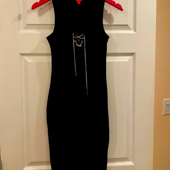 Black slightly below the knee dress by Guess with a silver chain style front. - Picture 1 of 5